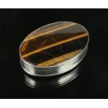 A George III silver ovoid snuff box by John Reily. Set with two tigers eye panels and with engine