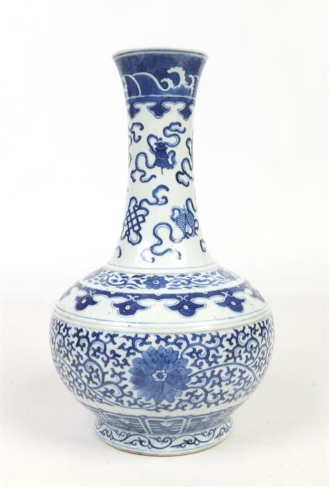 A 19th Chinese blue and white bottle shaped vase. Painted in underglaze blue with precious objects