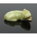 A Chinese Qing dynasty carved jade model of a recumbent animal, 6cm. Condition report intended as
