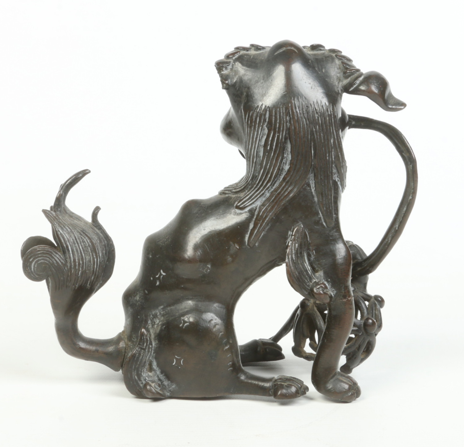 An antique Chinese patinated bronze sculpture of a lion dog guarding a brocade bowl, possibly - Image 5 of 7