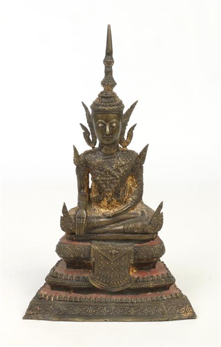 A 19th century Sino-Tibetan gilt bronze statue of a seated Buddha raised on a stepped plinth,