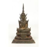 A 19th century Sino-Tibetan gilt bronze statue of a seated Buddha raised on a stepped plinth,