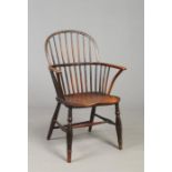 A 19th century ash and elm stick back Windsor armchair. Raised on turned supports with H stretcher.