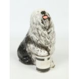 A Beswick advertising figure for Dulux. Formed as an Old English Sheepdog with one foot upon a can