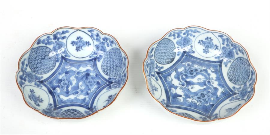 A pair of Japanese blue and white scalloped bowls. With brown line rims and painted in underglaze