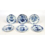 Six similar 18th century Dutch delft blue and white plates, all decorated with flowers, 22.25cm