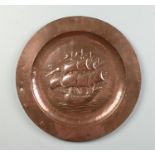 An Arts & Crafts Newlyn copper plaque. Embossed with a three mast shipped under a planished