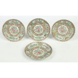 Four 19th century Cantonese plates. Painted with grounds of butterflies, flowers and panels