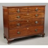 A George III mahogany two over three chest of drawers. Crossbanded, with strung inlay, bone