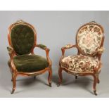 A pair of Victorian carved and figured walnut salon armchairs. Upholstered, with gilt metal mounts