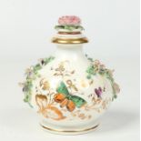 A large Rockingham globular scent bottle and stopper. With gilt bands, applied with flowers and