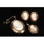 An assembled suite of 9 carat gold and carved shell cameo jewellery comprising a brooch, pendant and