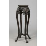 A Chinese carved hardwood octagonal baluster jardiniere stand with marble top, 90cm. Condition