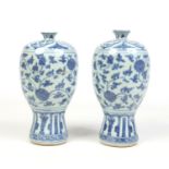 A pair of 20th century Chinese meiping blue and white vases. Painted in underglaze blue with