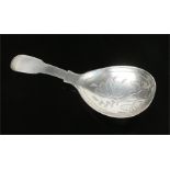 A George III silver fiddle pattern caddy spoon, with wrigglework fig shaped bowl. Assayed London