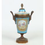 A 19th century Sevres potpourri jar and cover with gilt metal mounts. Blue ground and with gilt