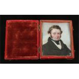 A Victorian ivory portrait miniature of a gentleman in a leather mounted folding case, 7.25cm x 5.