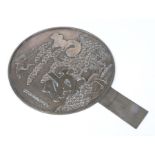 A large Japanese Meiji period polished bronze hand mirror. Decorated in relief with a pair of