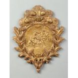 A 19th century French Baroque style carved giltwood wall plaque decorated in relief with a Religious