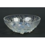 A Lalique opaline glass bowl decorated in relief with the gui pattern of stylized mistletoe.