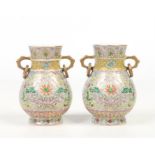 A pair of Chinese Republic period twin handled baluster famille rose vases in fitted case. With