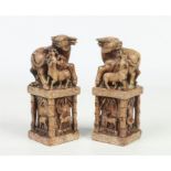 A pair of Chinese carved soapstone scholars seals. Each surmounted with a water buffalo and calf.