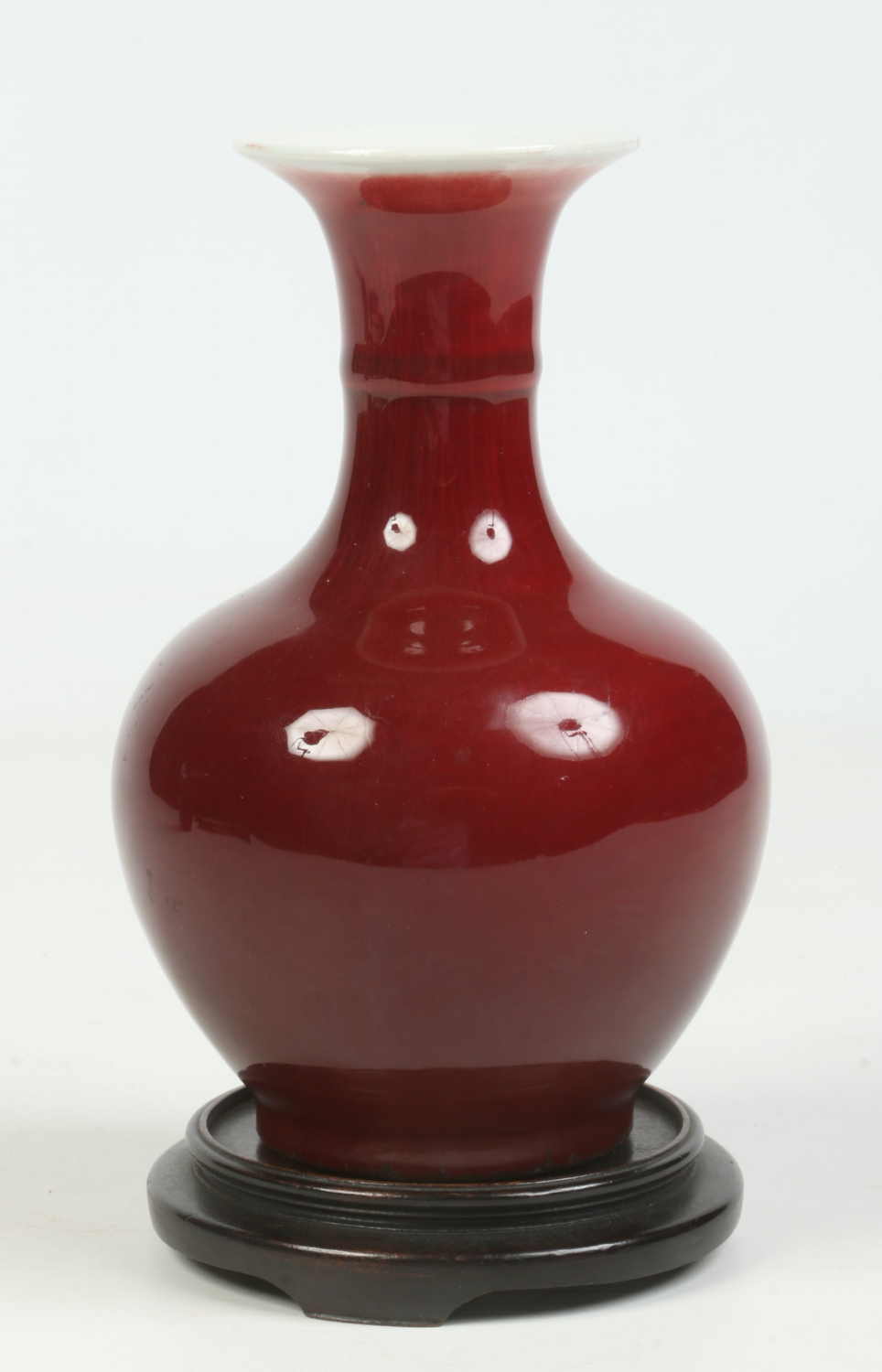 A Chinese small baluster vase on hardwood plinth. With ring moulded neck and decorated in sang de - Image 4 of 6