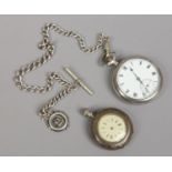 A silver pocket watch by Nirvana International Watch Company on Albert chain with silver fob,