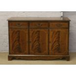 A inlaid mahogany three door sideboard.