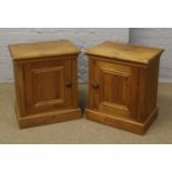 A pair of pine bedside cabinets.