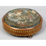 A Victorian circular footstool with beadwork top and parquetry inlay. Condition report intended as a