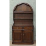 A carved and panelled oak dresser with dome top. Condition report intended as a guide only.