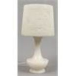 An alabaster tablelamp with floral shade.