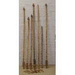 Seven poker work curtain poles with curtain rings including a bamboo example.