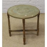 Indian brass top table on folding base.