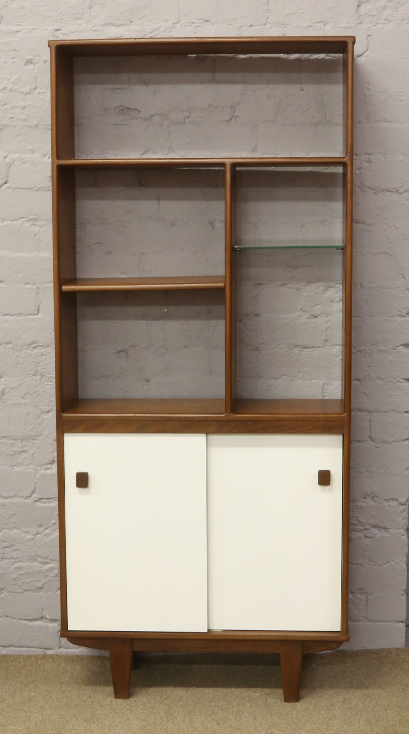 A retro teak bookcase / shelving unit with cupboard base.