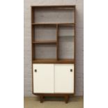 A retro teak bookcase / shelving unit with cupboard base.