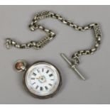 A Victorian silver fob watch with engraving to the case, white enamel dial with gilt decoration