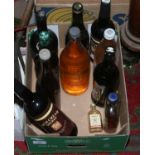 A collection of bottled alcohol to include Cognac, Sherry etc.