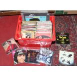 A box of mainly single records to include The Rolling Stones, Beatles, Elvis Presley, Sex Pistols