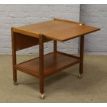 A teak two tier drop leaf tea trolley.