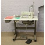 A Bernina professional sewing machine and worktable fitted with a cansew clutch motor with