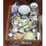 A box of Chinese and Japanese ceramics including bone china teawares, figurines, vases etc.