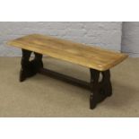 An oak priory style coffee table with stripped top.