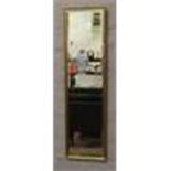 A gilt framed full length bevel edge wall mirror.