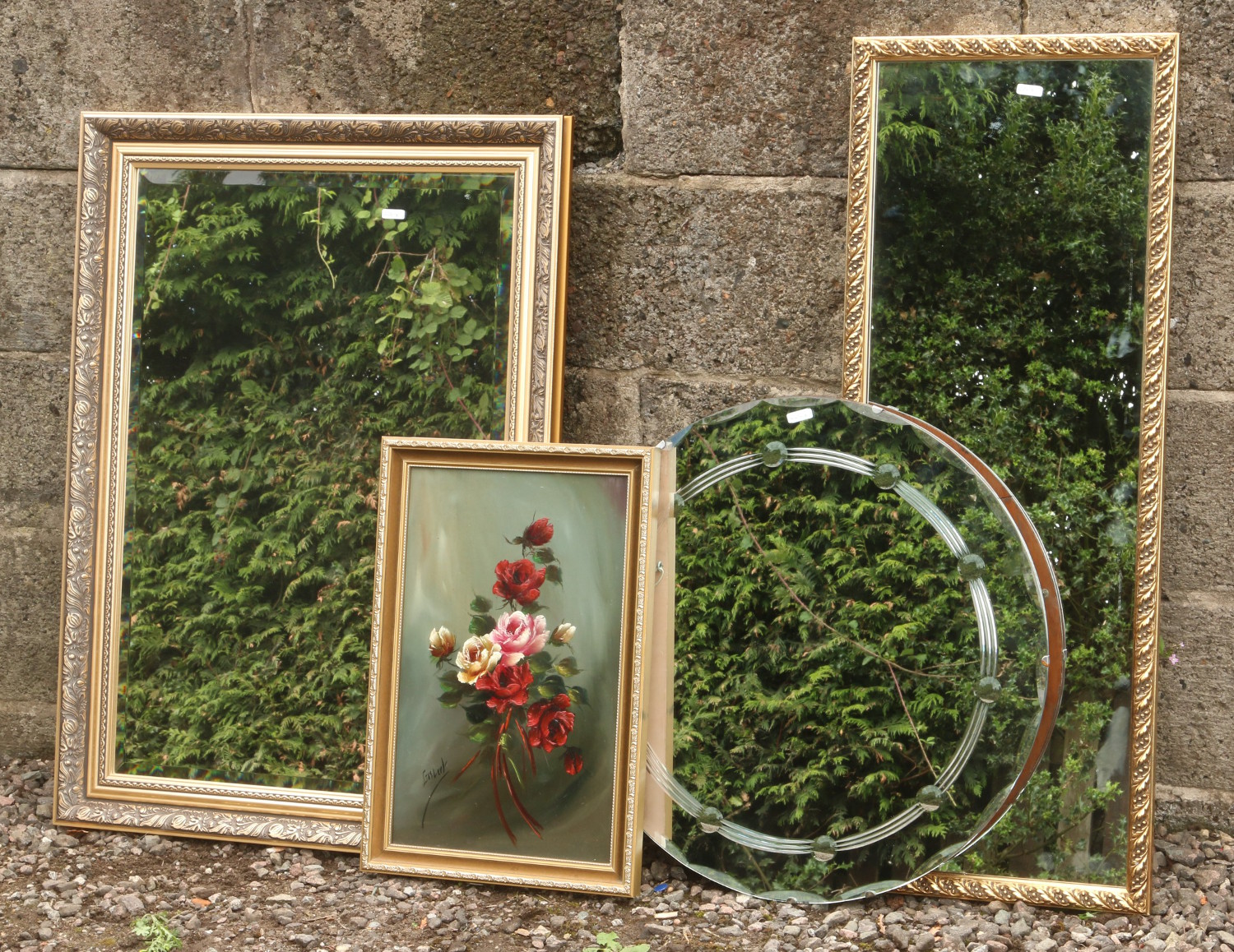 Two gilt framed wall mirrors, along with a circular example and a gilt framed still life picture.