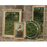 Two gilt framed wall mirrors, along with a circular example and a gilt framed still life picture.