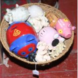 A standing basket of ceramic pig penny banks etc.