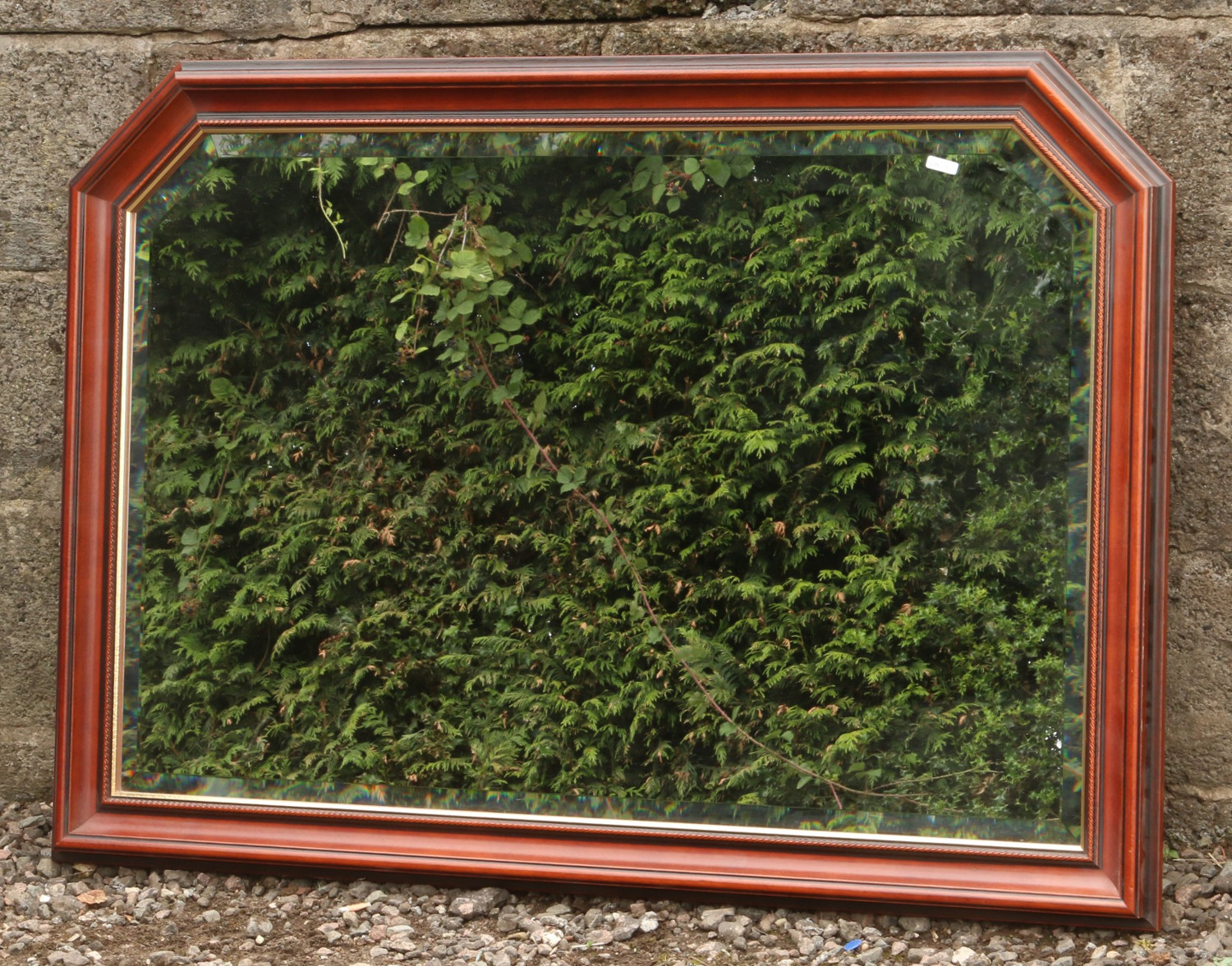 A mahogany framed bevel edge wall mirror.