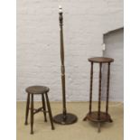 A turned mahogany standard lamp, along with a bobbin turn jardiniere stand and wooden stool.